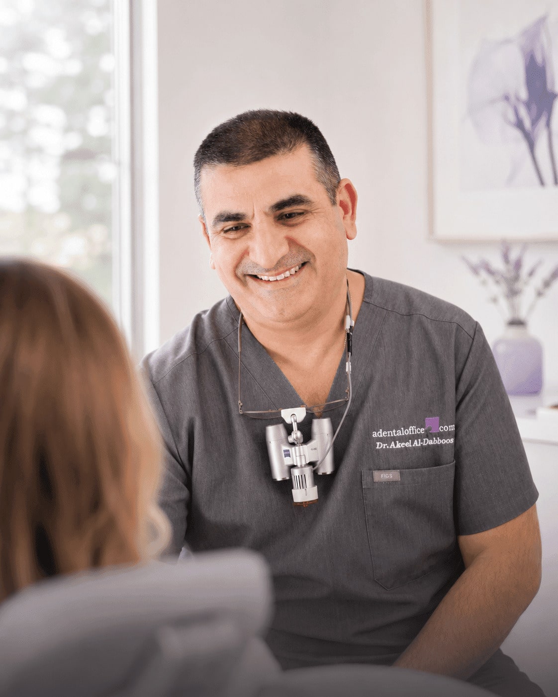 Dr. Akeel Al-Dabboos providing gentle dental care to a smiling patient at A Dental Office in Barrie, Ontario